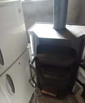 Superbe cheminée à bois en vraie fonte